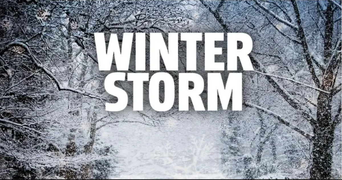 Winter Storm graphic with snow covered tree background